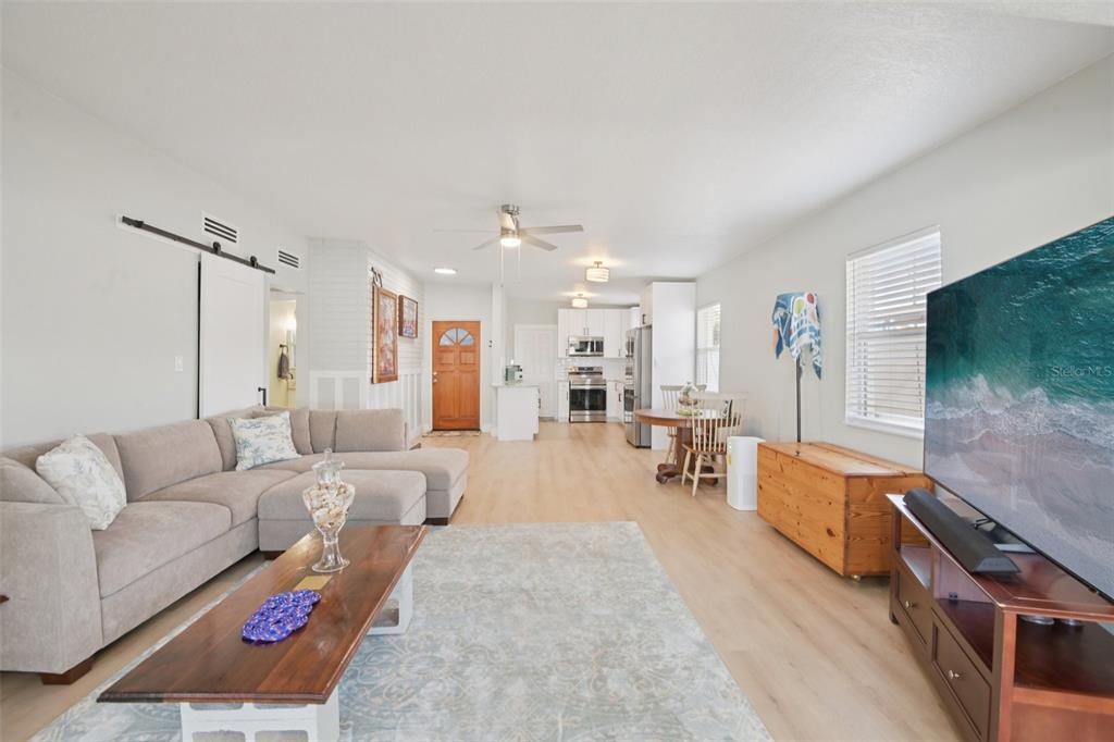 204 160th Avenue Redington Beach, FL 33708 - Photo 10 of 32 a living room with furniture and a flat screen tv