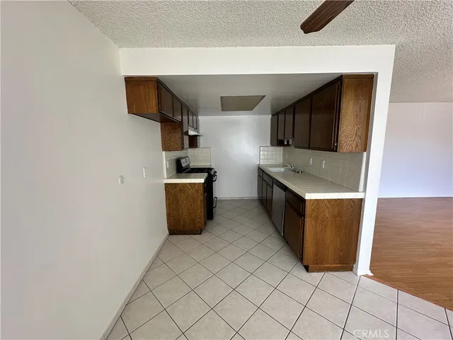 a kitchen with stainless steel appliances a refrigerator and a stove