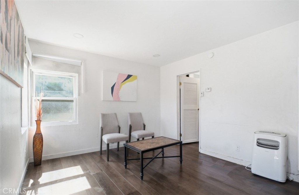 21719 Neptune Avenue Carson, CA 90745 - Photo 2 of 8 a living room with furniture and a window