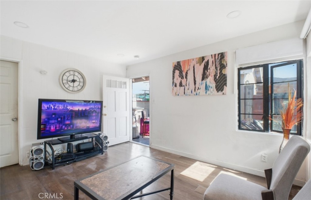21719 Neptune Avenue Carson, CA 90745 - Photo 3 of 8 a living room with furniture and a flat screen tv