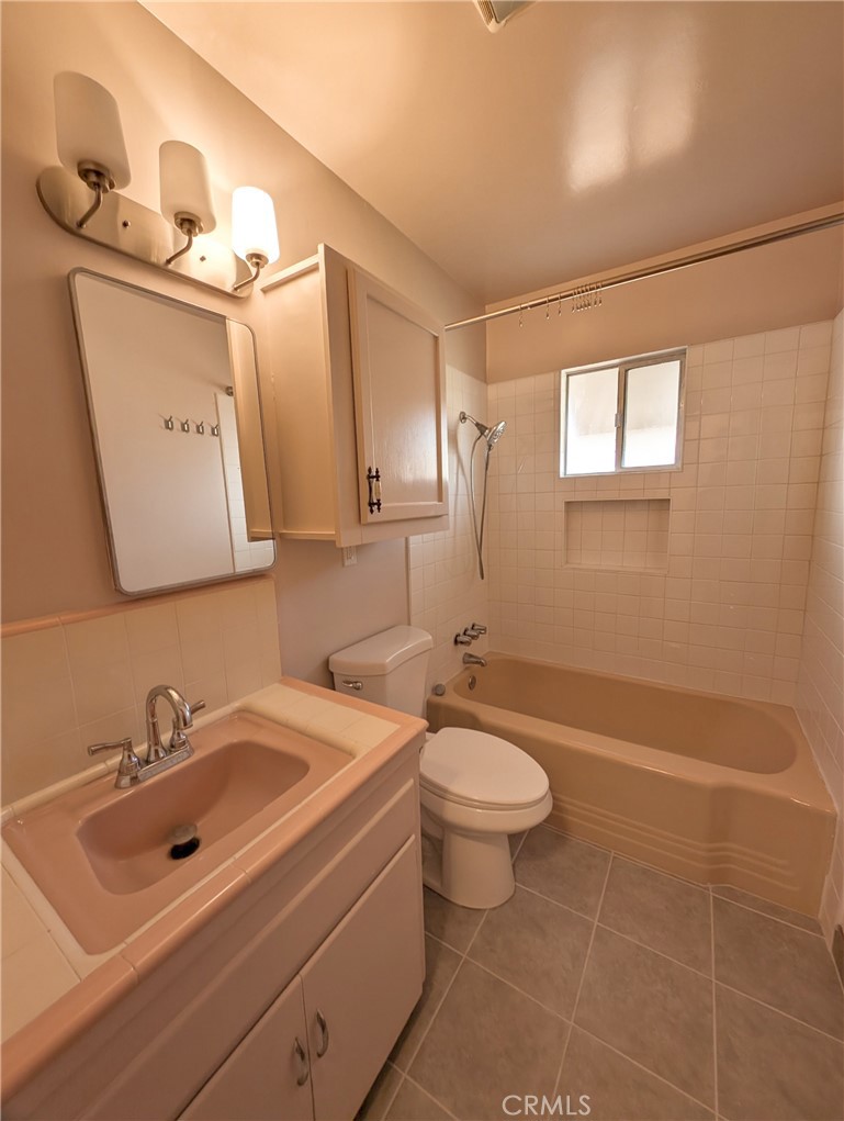 379 North 3rd Street Grover Beach, CA 93433 - Photo 22 of 24 a bathroom with a toilet sink and mirror