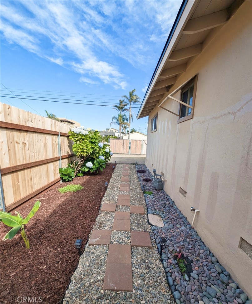 379 North 3rd Street Grover Beach, CA 93433 - Photo 24 of 24 a view of a backyard with potted plants