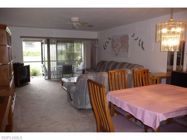 5697 Rattlesnake Hammock Road, Unit C106 Naples, FL 34113 - Photo 3 of 11 Foyer to Back Door