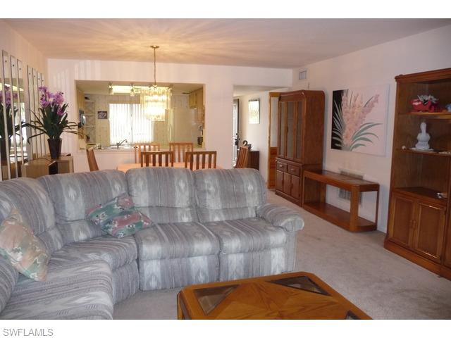 5697 Rattlesnake Hammock Road, Unit C106 Naples, FL 34113 - Photo 4 of 11 Living Room to Front Door