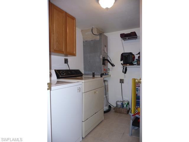 5697 Rattlesnake Hammock Road, Unit C106 Naples, FL 34113 - Photo 7 of 11 Utility Room
