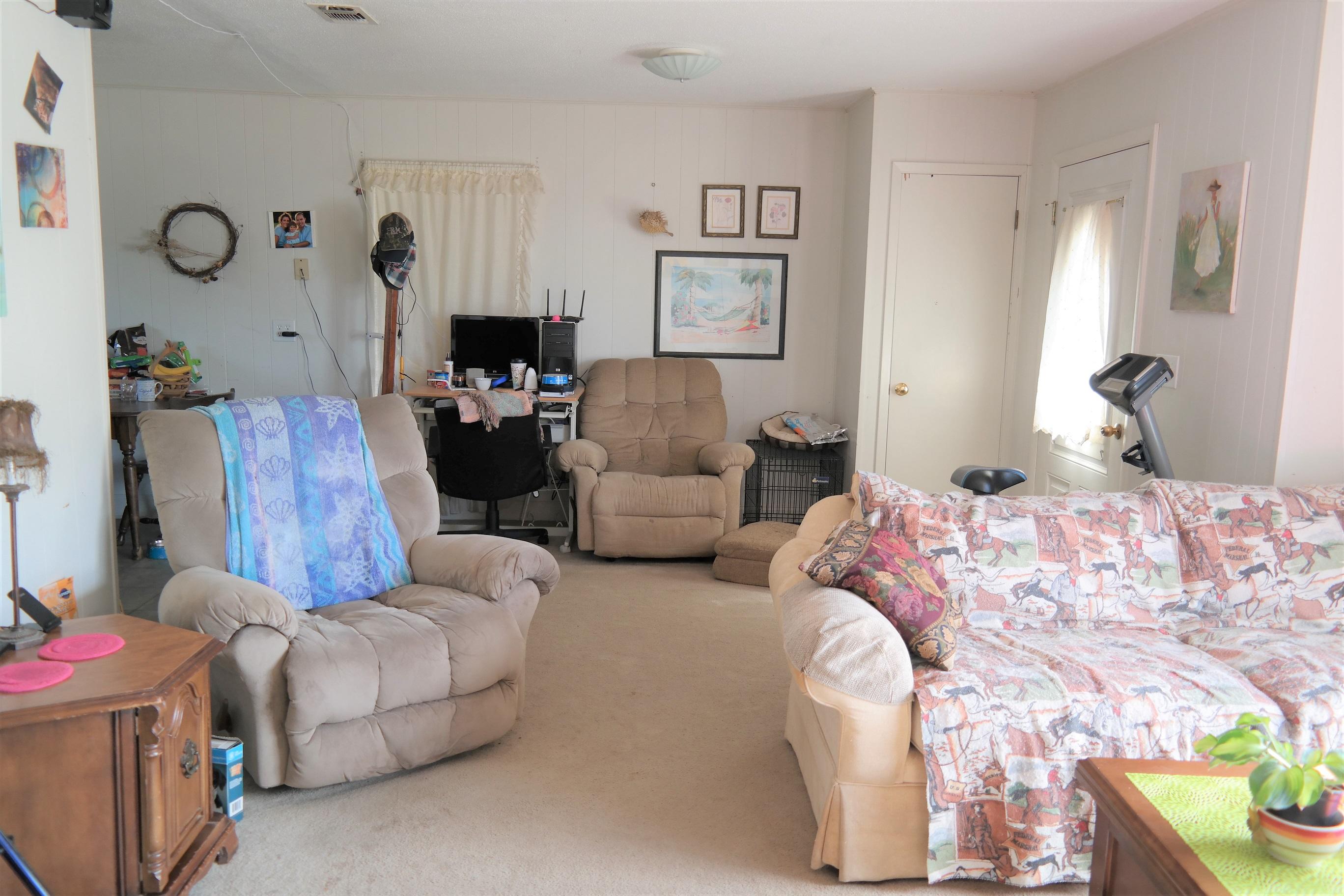 1414 Sexton Road DeFuniak Springs, FL 32433 - Photo 8 of 28 a bedroom with bed and a couch