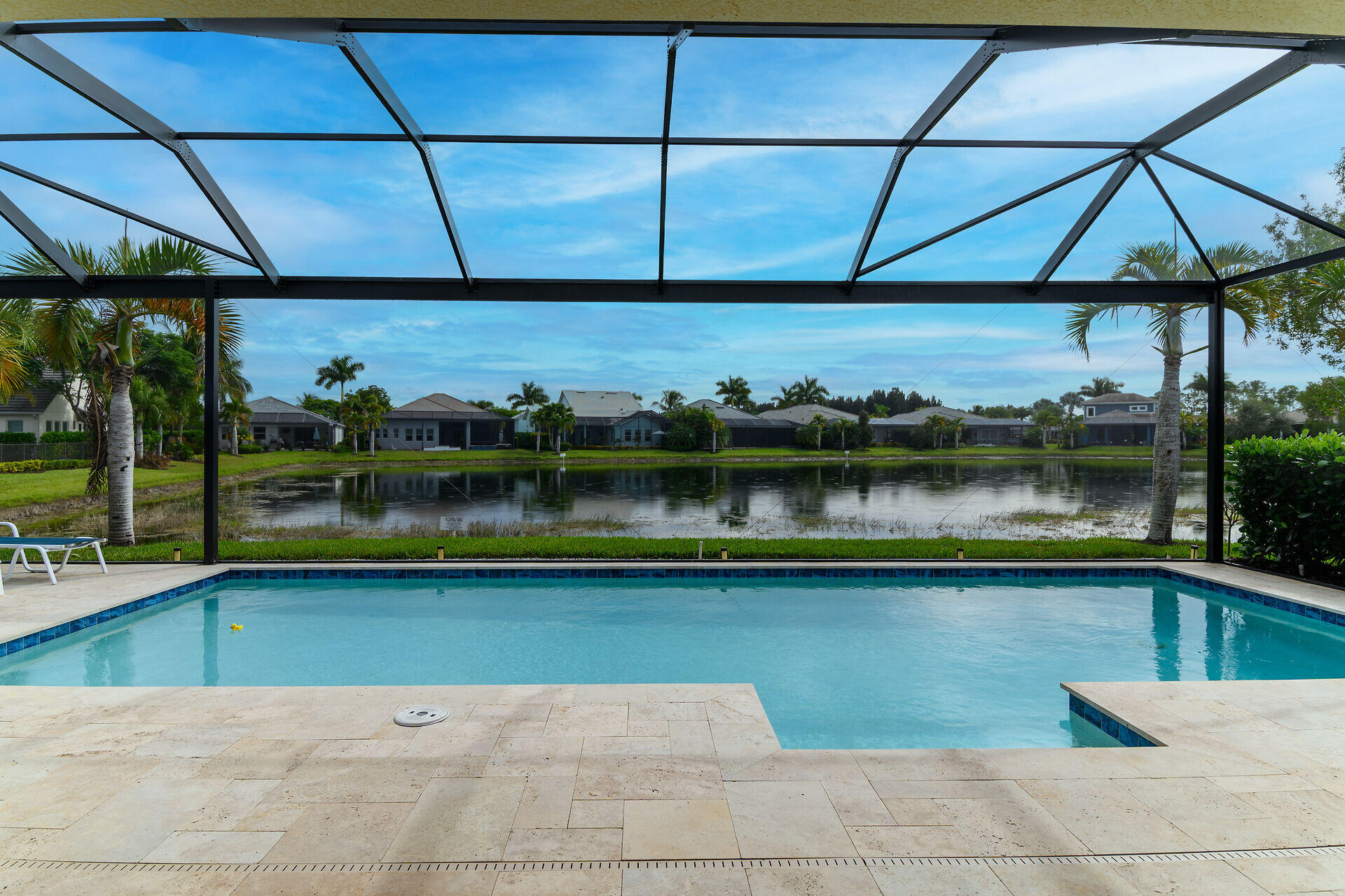 14730 Nautilus Place Naples, FL 34114 - Photo 14 of 56 a view of a swimming pool and a back yard