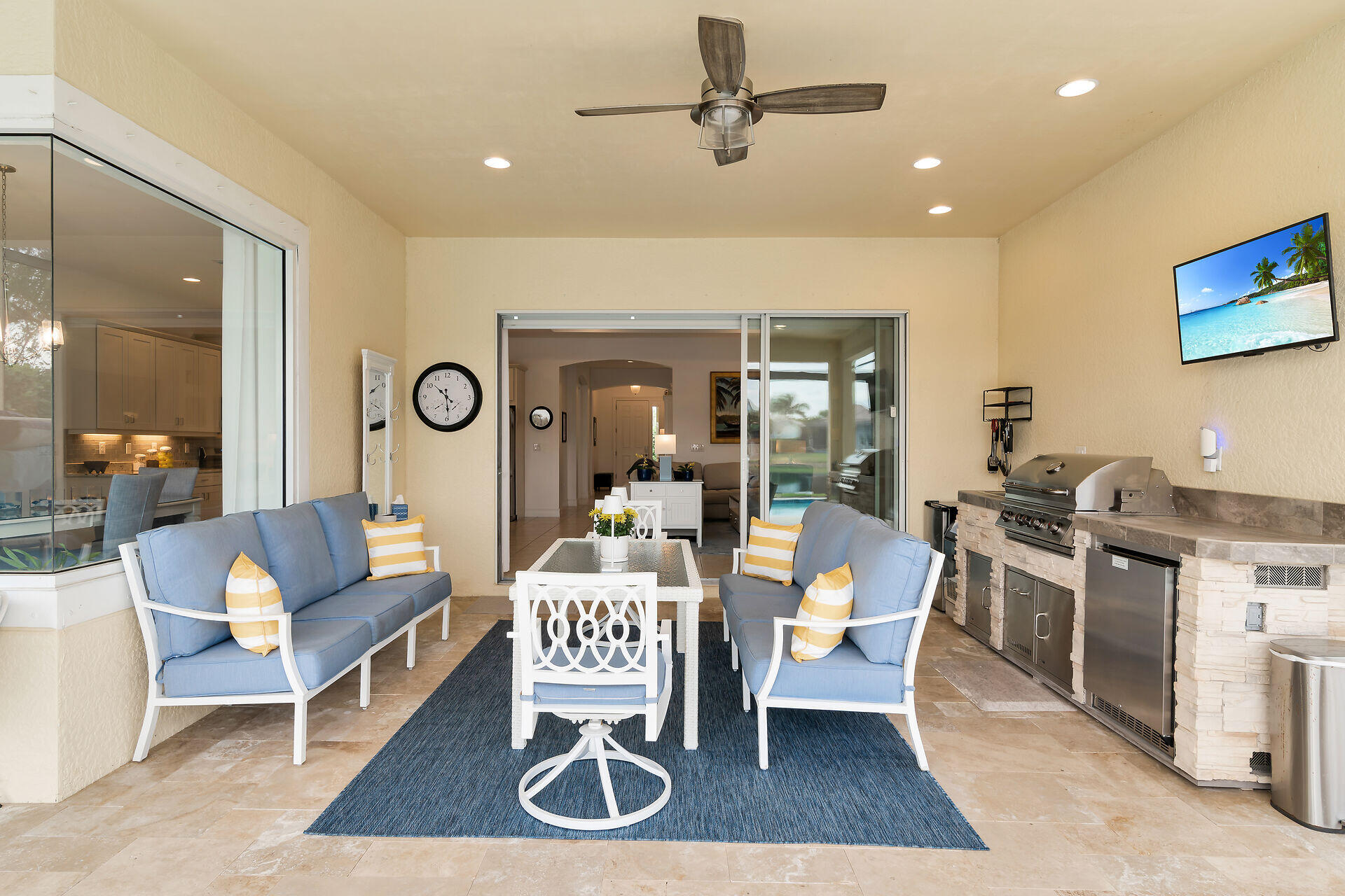 14730 Nautilus Place Naples, FL 34114 - Photo 17 of 56 a living room with furniture a rug and a chandelier