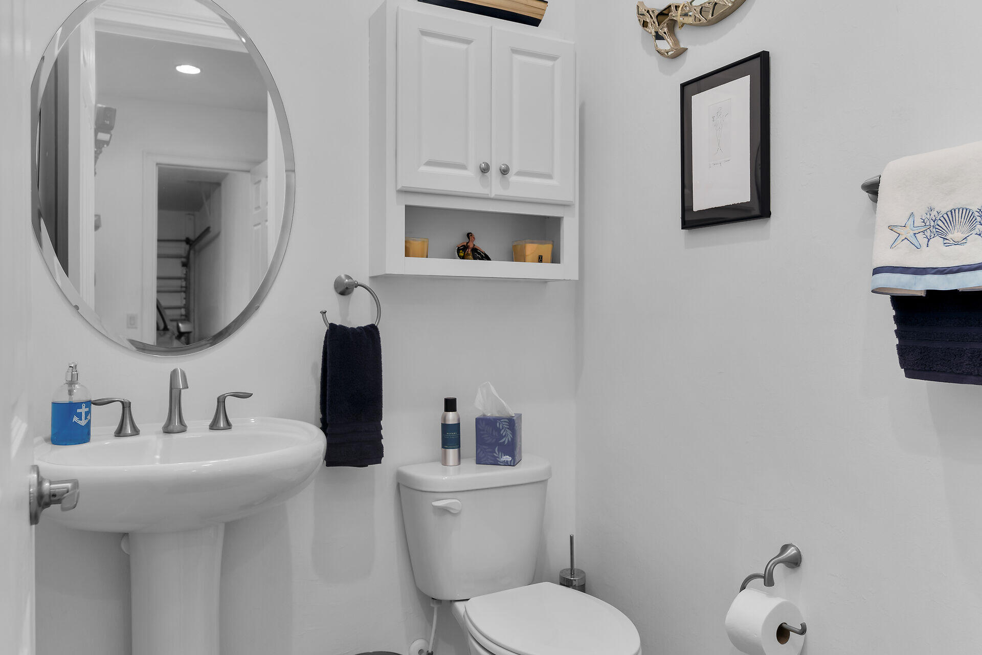 14730 Nautilus Place Naples, FL 34114 - Photo 27 of 56 a bathroom with a toilet sink and mirror