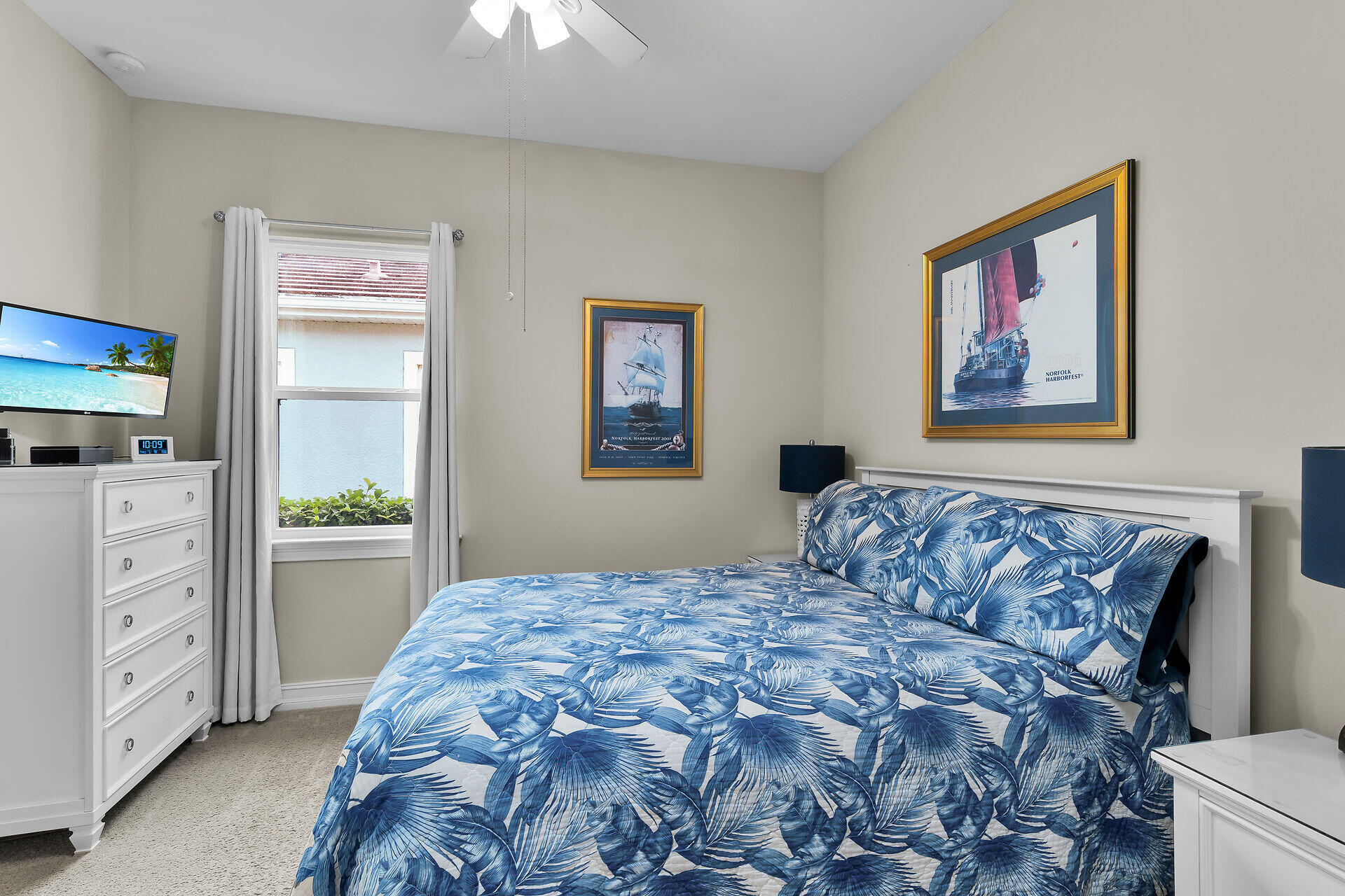 14730 Nautilus Place Naples, FL 34114 - Photo 29 of 56 a bedroom with a large bed and a chandelier
