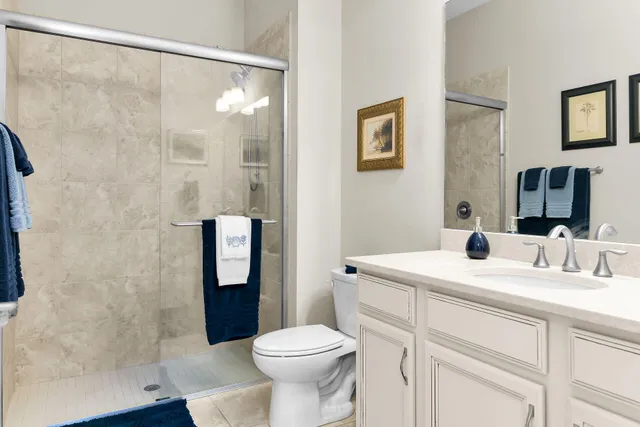 a bathroom with a shower and a sink