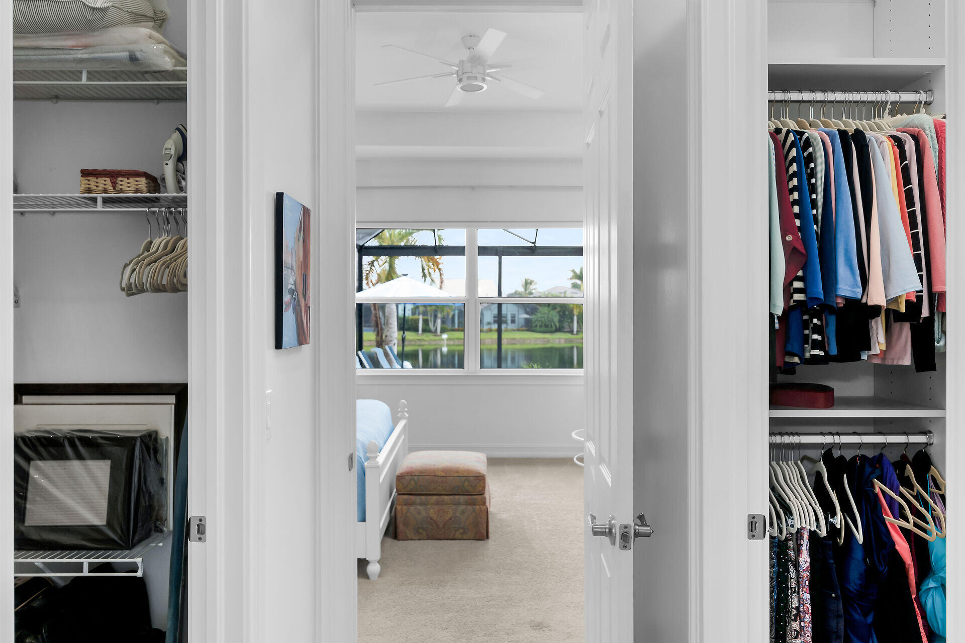 14730 Nautilus Place Naples, FL 34114 - Photo 35 of 56 a view of walk in closet with clothes and shoes