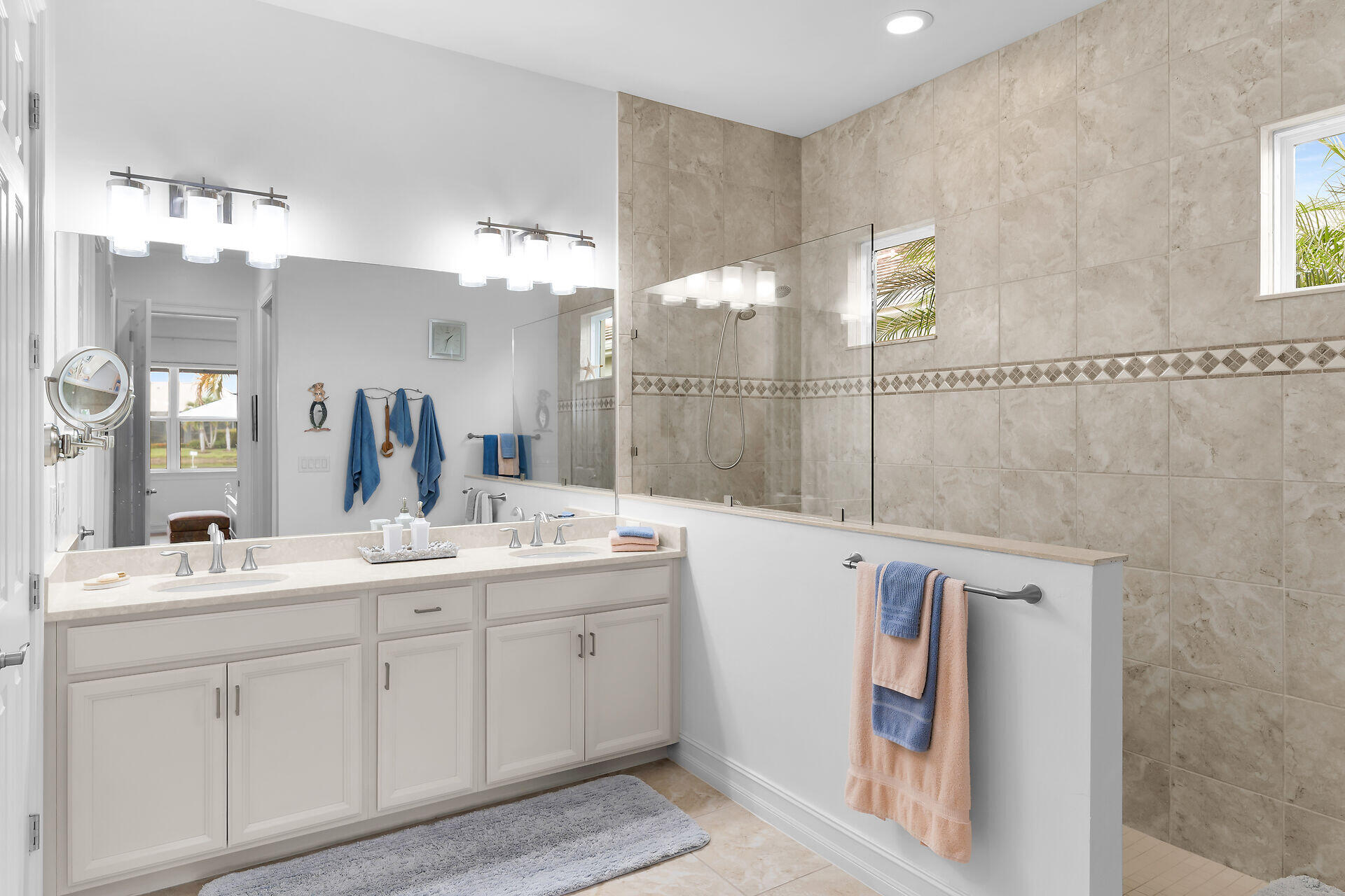 14730 Nautilus Place Naples, FL 34114 - Photo 36 of 56 a bathroom with a double vanity sink mirror and bathtub
