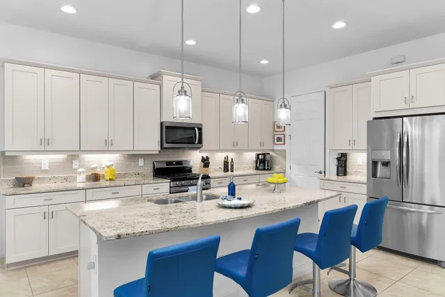 a kitchen with a sink and stove