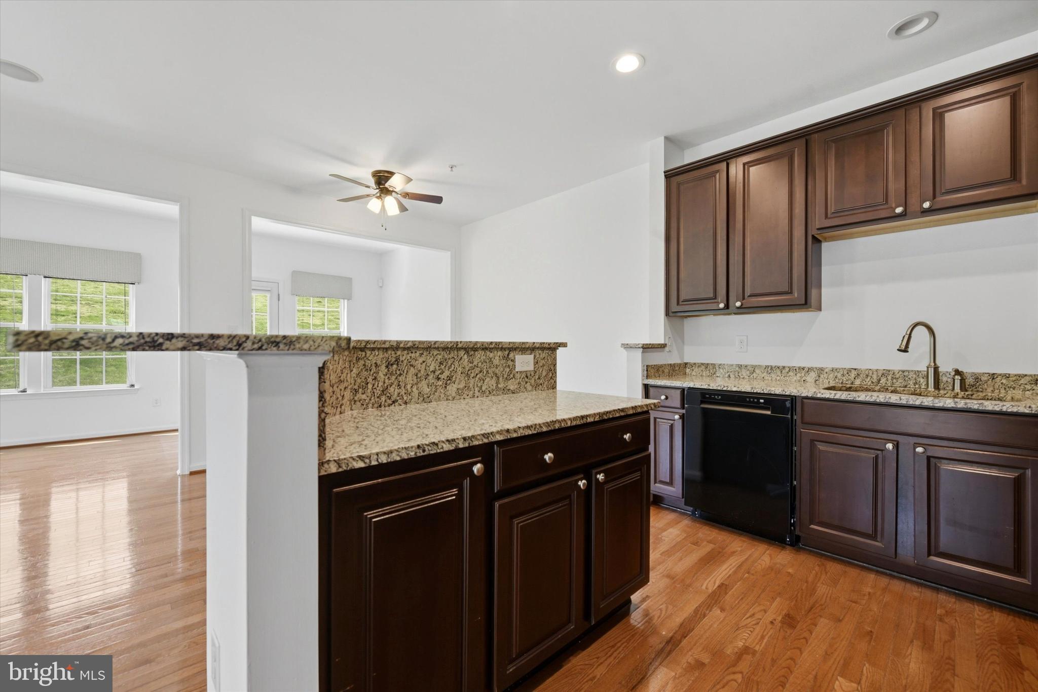 186 Tulsk Road Avondale, PA 19311 - Photo 17 of 38 a kitchen with granite countertop a sink cabinets and stainless steel appliances