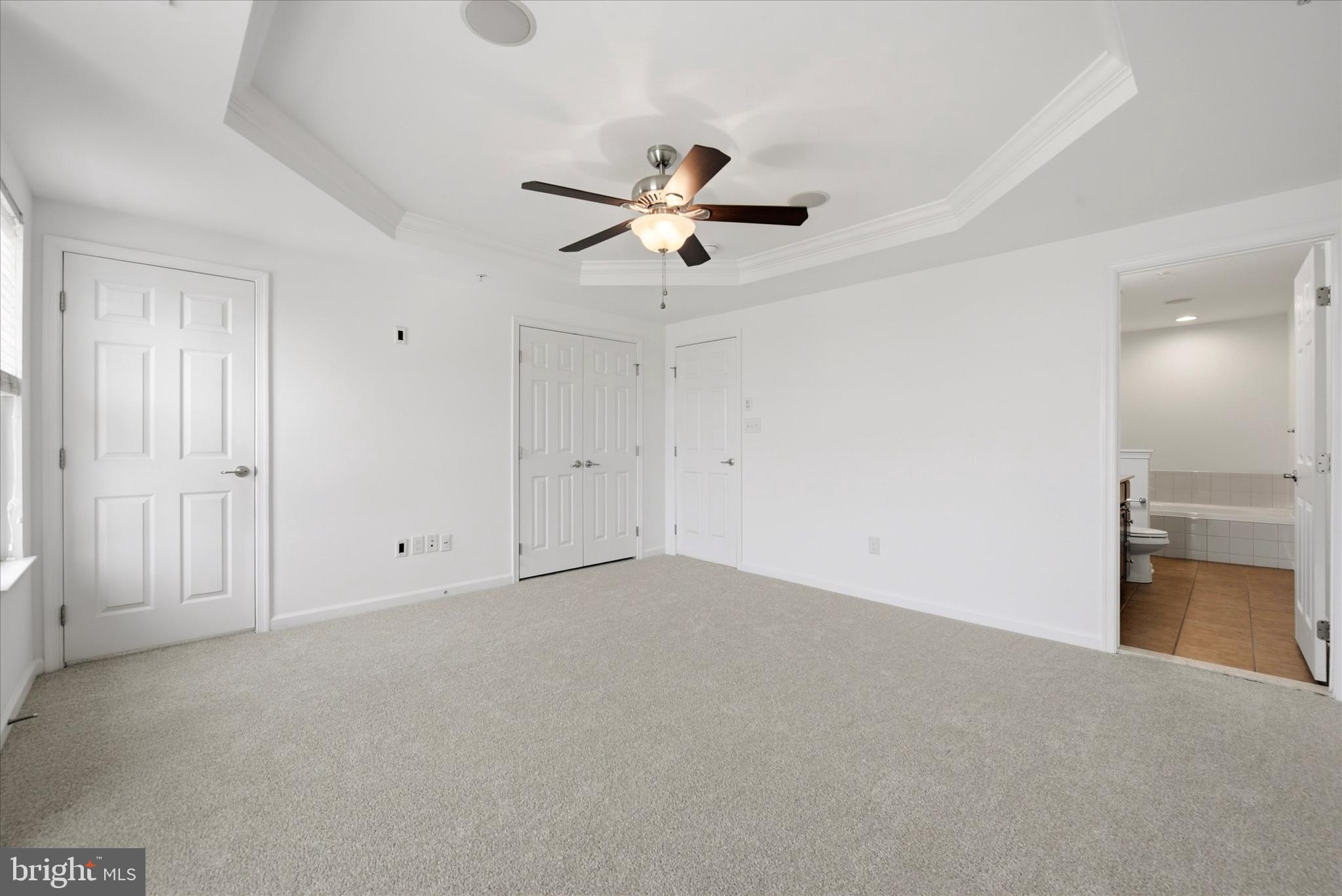 186 Tulsk Road Avondale, PA 19311 - Photo 22 of 38 an empty room with chandelier fan and windows