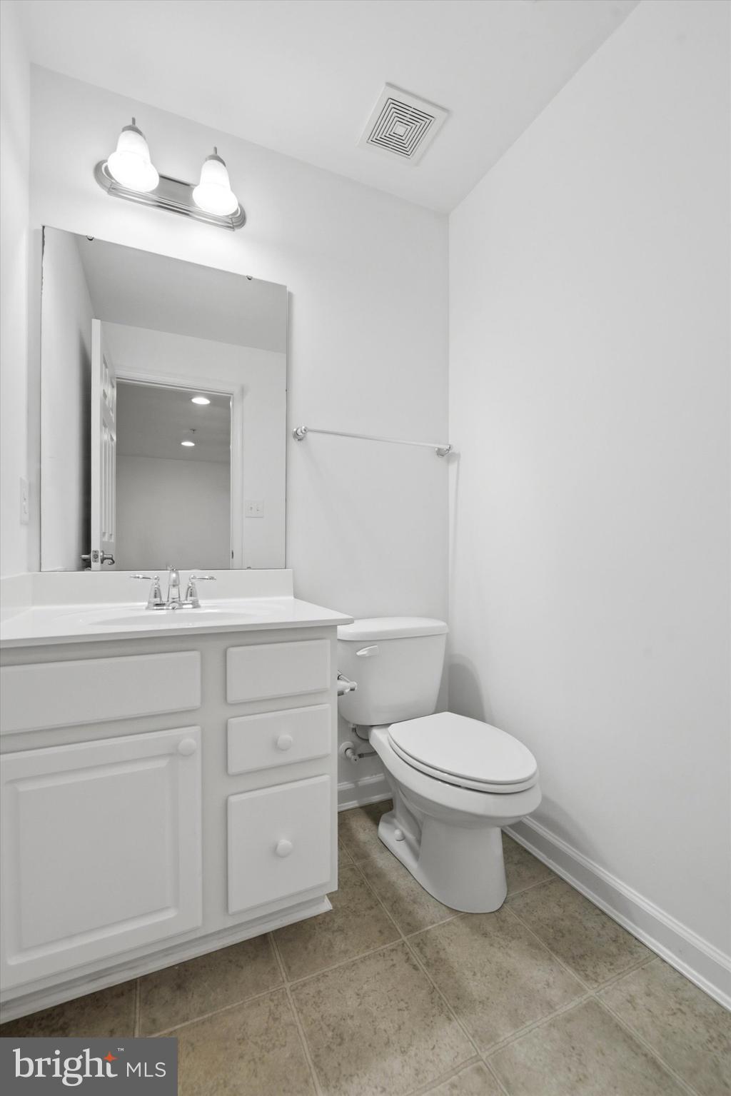 186 Tulsk Road Avondale, PA 19311 - Photo 36 of 38 a bathroom with a toilet a sink and mirror