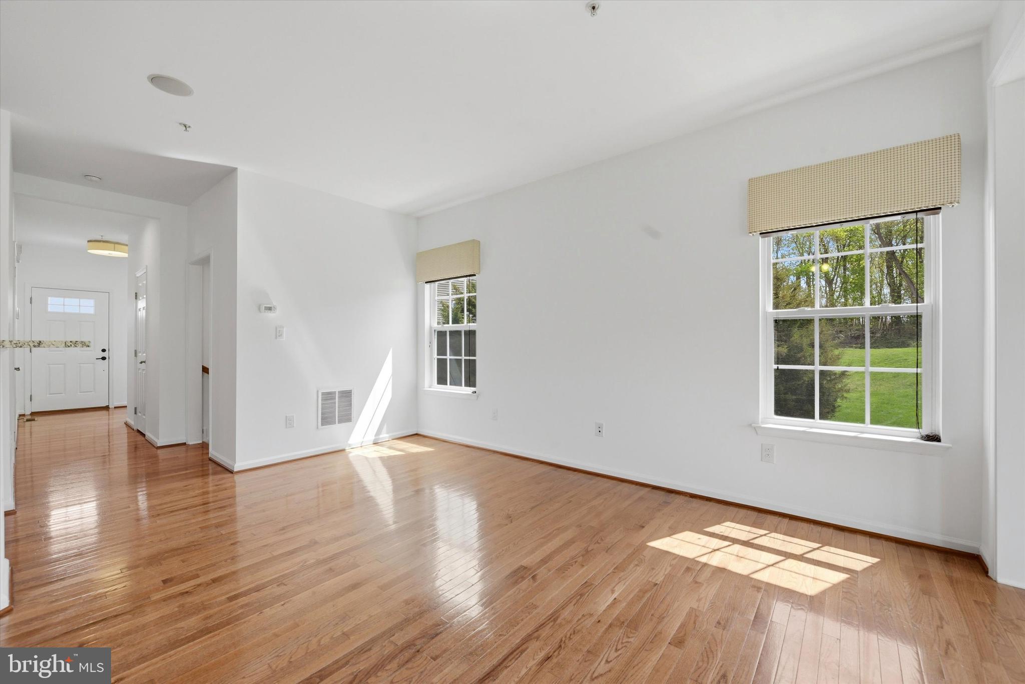 186 Tulsk Road Avondale, PA 19311 - Photo 10 of 38 an empty room with wooden floor and windows