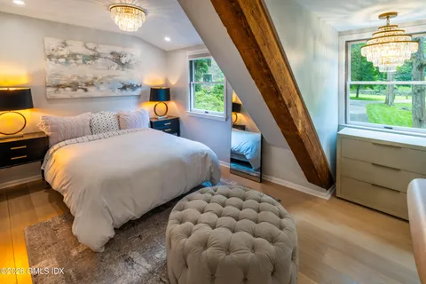 a bedroom with a bed and window