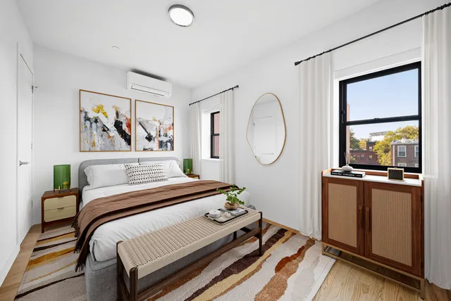 a kitchen with stainless steel appliances a stove a microwave and cabinets