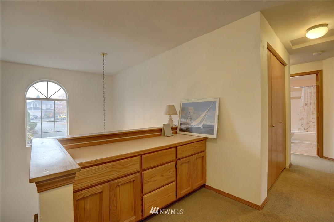 5142 South Garden Loop Road Seattle, WA 98118 - Photo 8 of 18 a room with a sink and cabinets