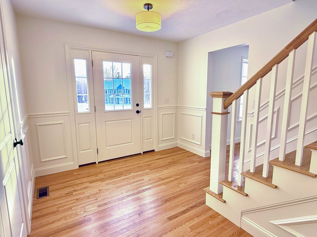 28 Forest Hill Drive Rutland, MA 01543 - Photo 11 of 23 a view of an entryway with wooden floor and door
