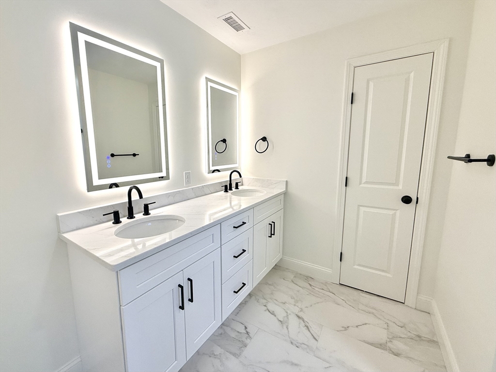 28 Forest Hill Drive Rutland, MA 01543 - Photo 15 of 23 a bathroom with a double vanity sink and mirror