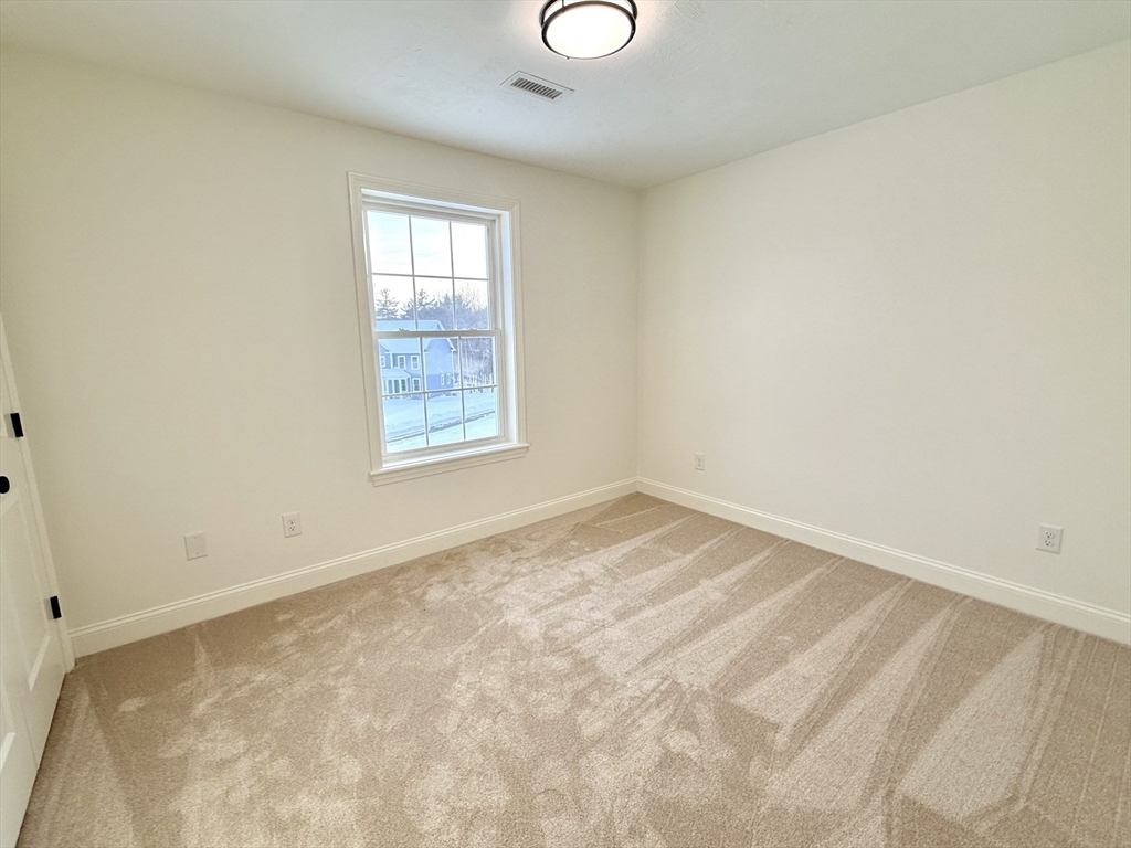 28 Forest Hill Drive Rutland, MA 01543 - Photo 20 of 23 an empty room with a window