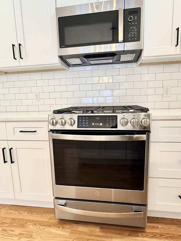 28 Forest Hill Drive Rutland, MA 01543 - Photo 6 of 23 a stove top oven sitting inside of a kitchen