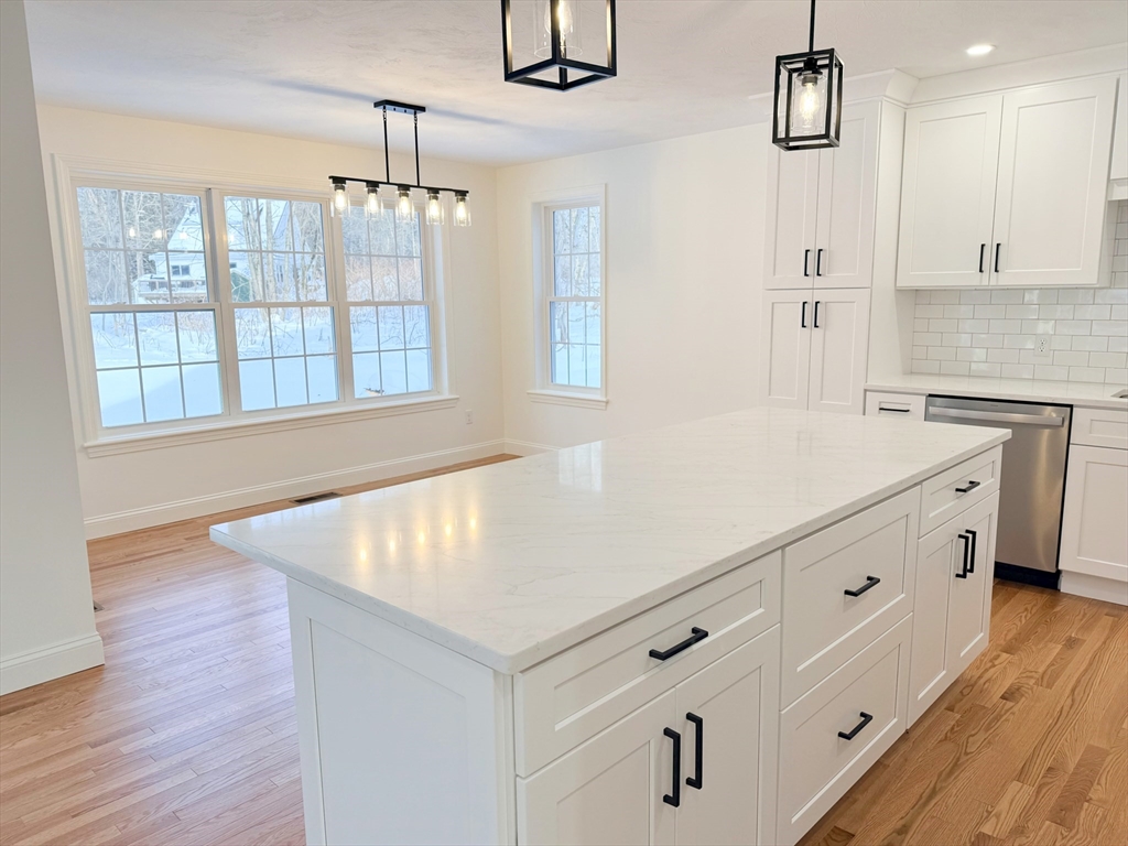 28 Forest Hill Drive Rutland, MA 01543 - Photo 7 of 23 a kitchen with white cabinets and window