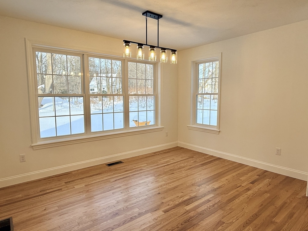28 Forest Hill Drive Rutland, MA 01543 - Photo 9 of 23 a view of an empty room with wooden floor and a window