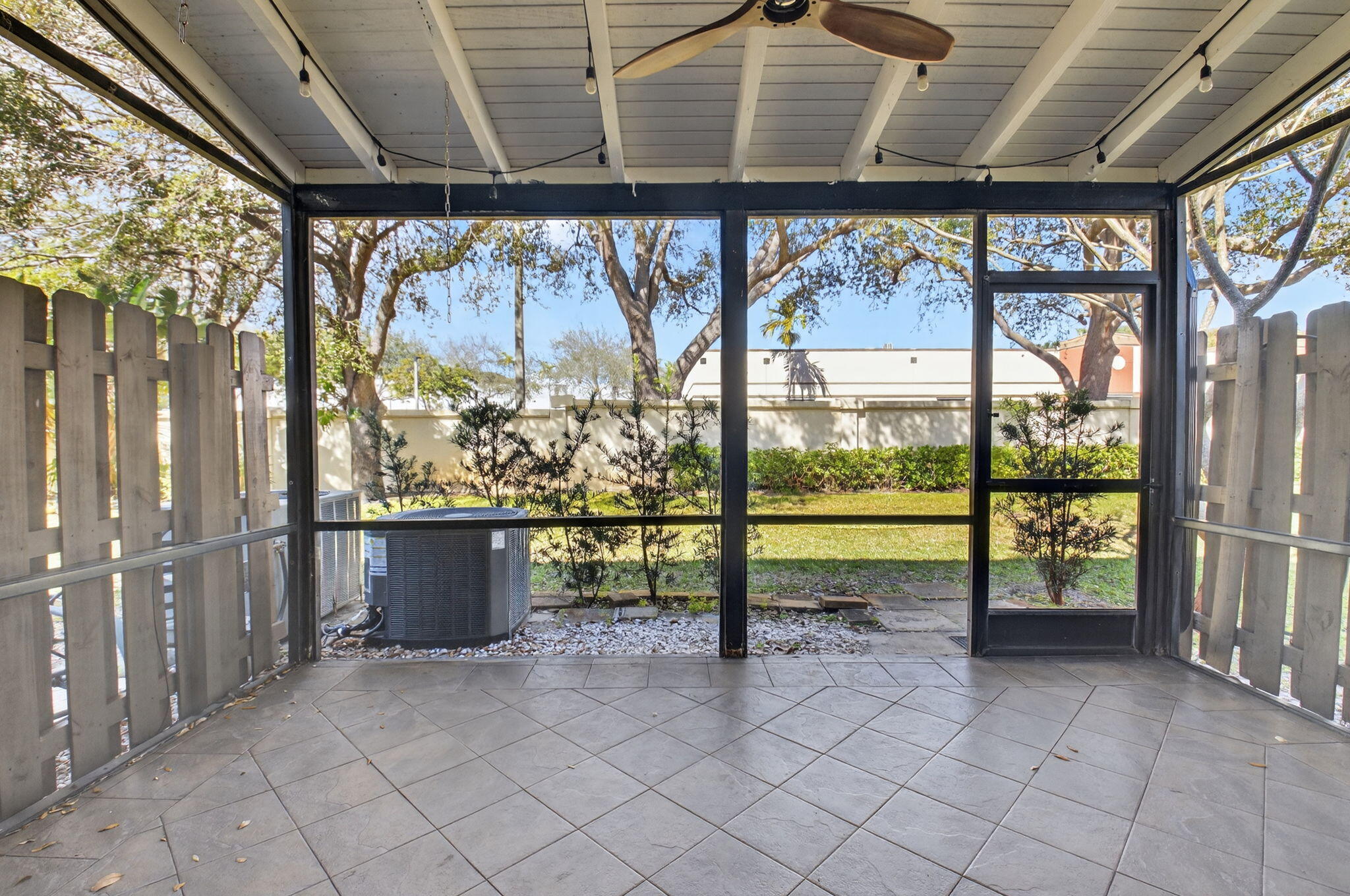 4761 Northwest 2nd Avenue, Unit 301 Boca Raton, FL 33431 - Photo 25 of 56 a view of a porch with a table and chairs