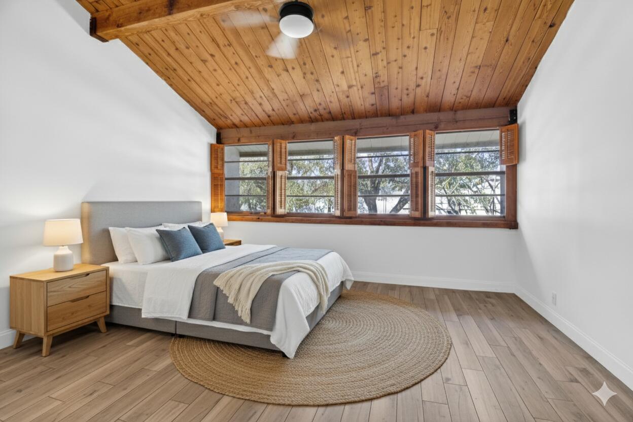 4761 Northwest 2nd Avenue, Unit 301 Boca Raton, FL 33431 - Photo 3 of 56 a spacious bedroom with a bed and wooden floor