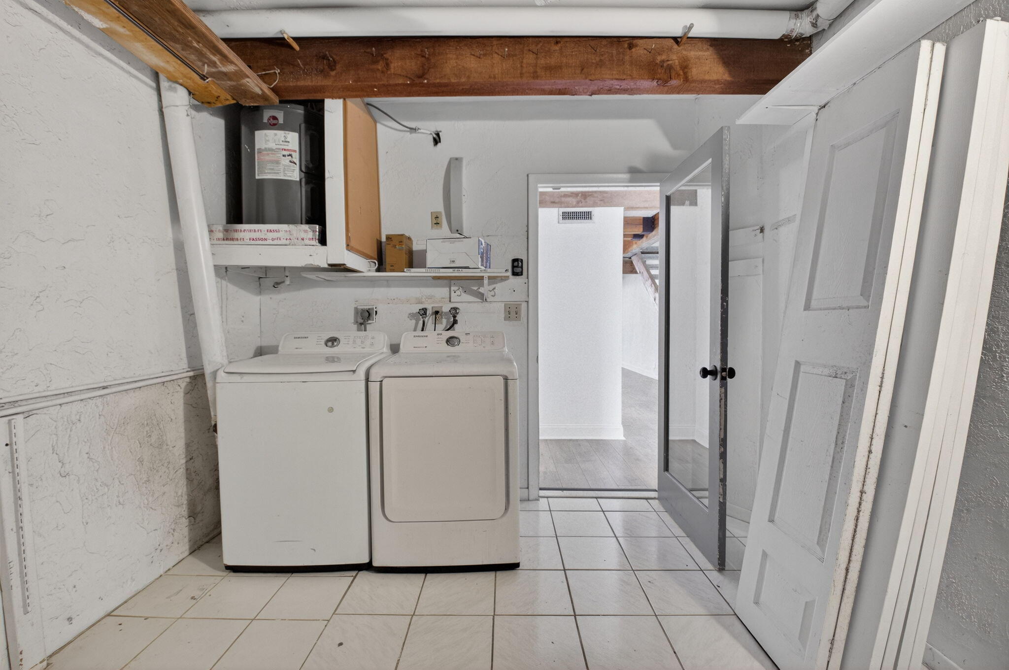 4761 Northwest 2nd Avenue, Unit 301 Boca Raton, FL 33431 - Photo 33 of 56 a utility room with cabinets washer and dryer