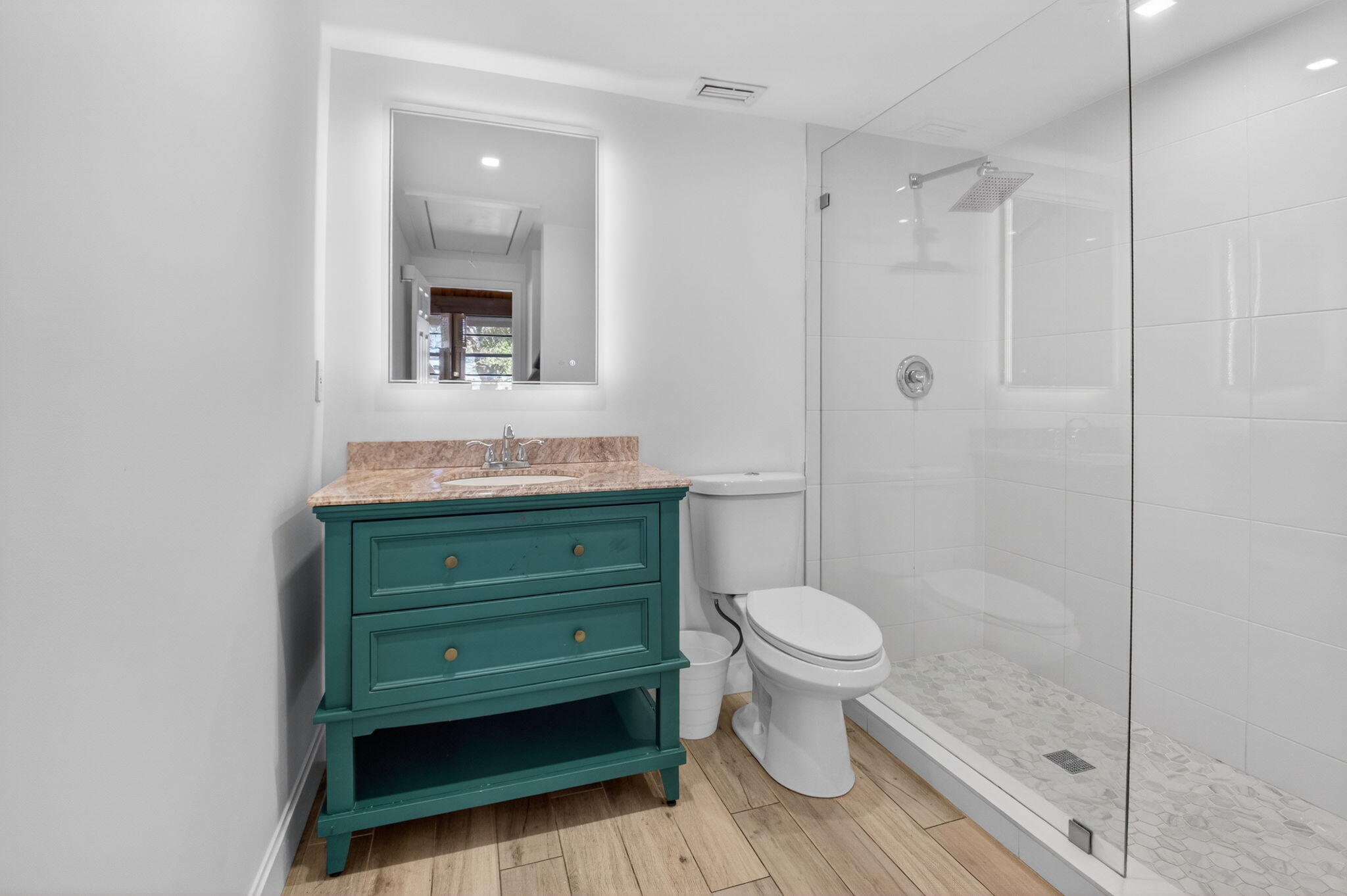 4761 Northwest 2nd Avenue, Unit 301 Boca Raton, FL 33431 - Photo 37 of 56 a bathroom with a granite countertop toilet and a sink