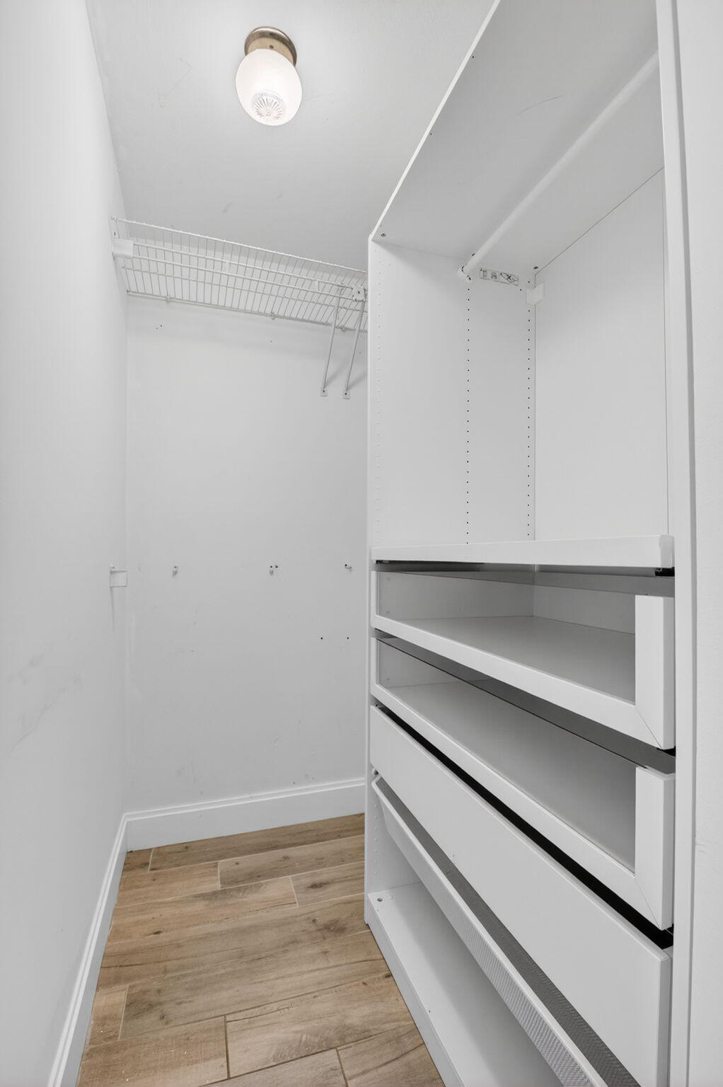 4761 Northwest 2nd Avenue, Unit 301 Boca Raton, FL 33431 - Photo 39 of 56 a view of an empty walk in closet