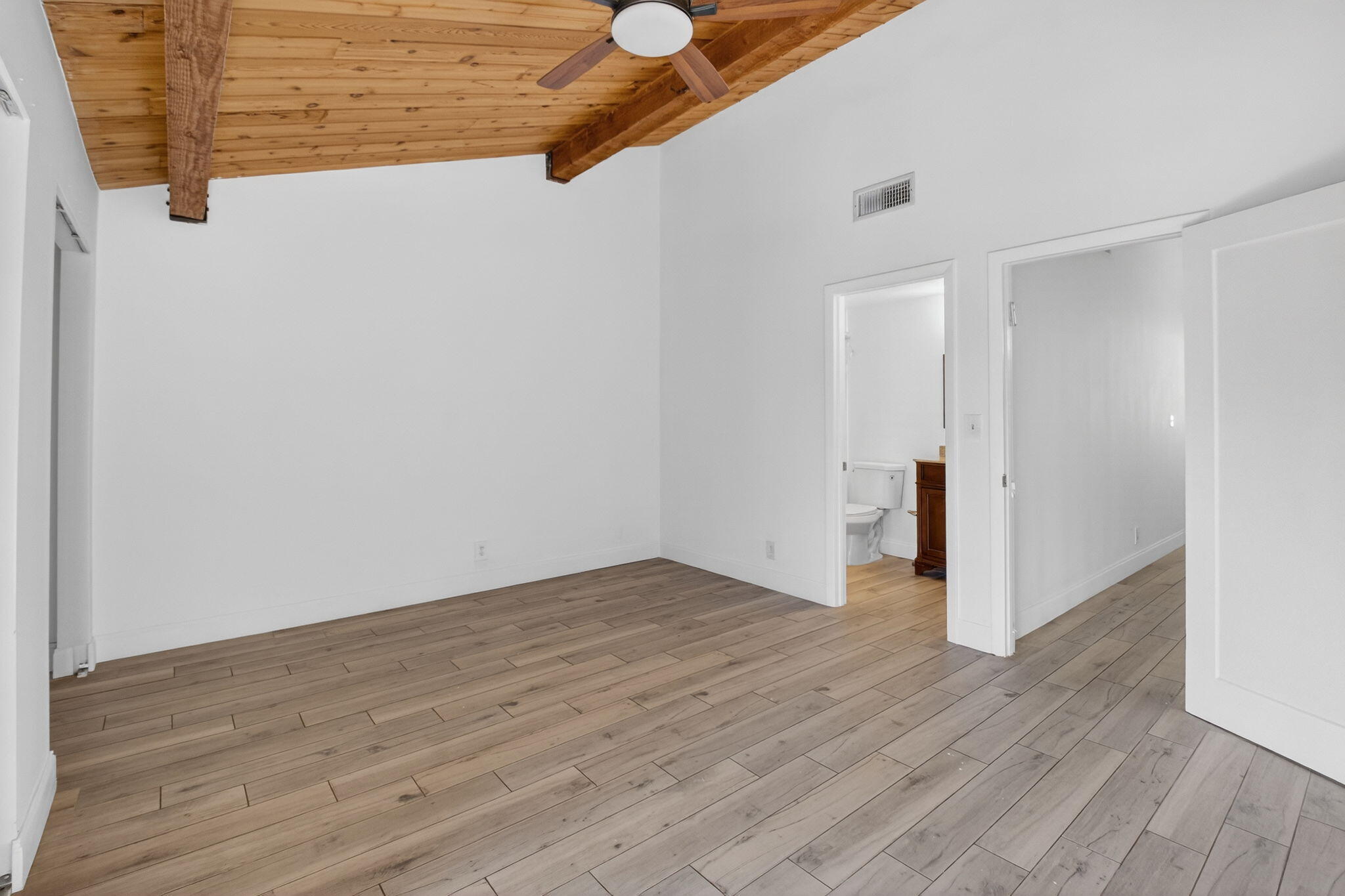 4761 Northwest 2nd Avenue, Unit 301 Boca Raton, FL 33431 - Photo 42 of 56 a view of an empty room with wooden floor