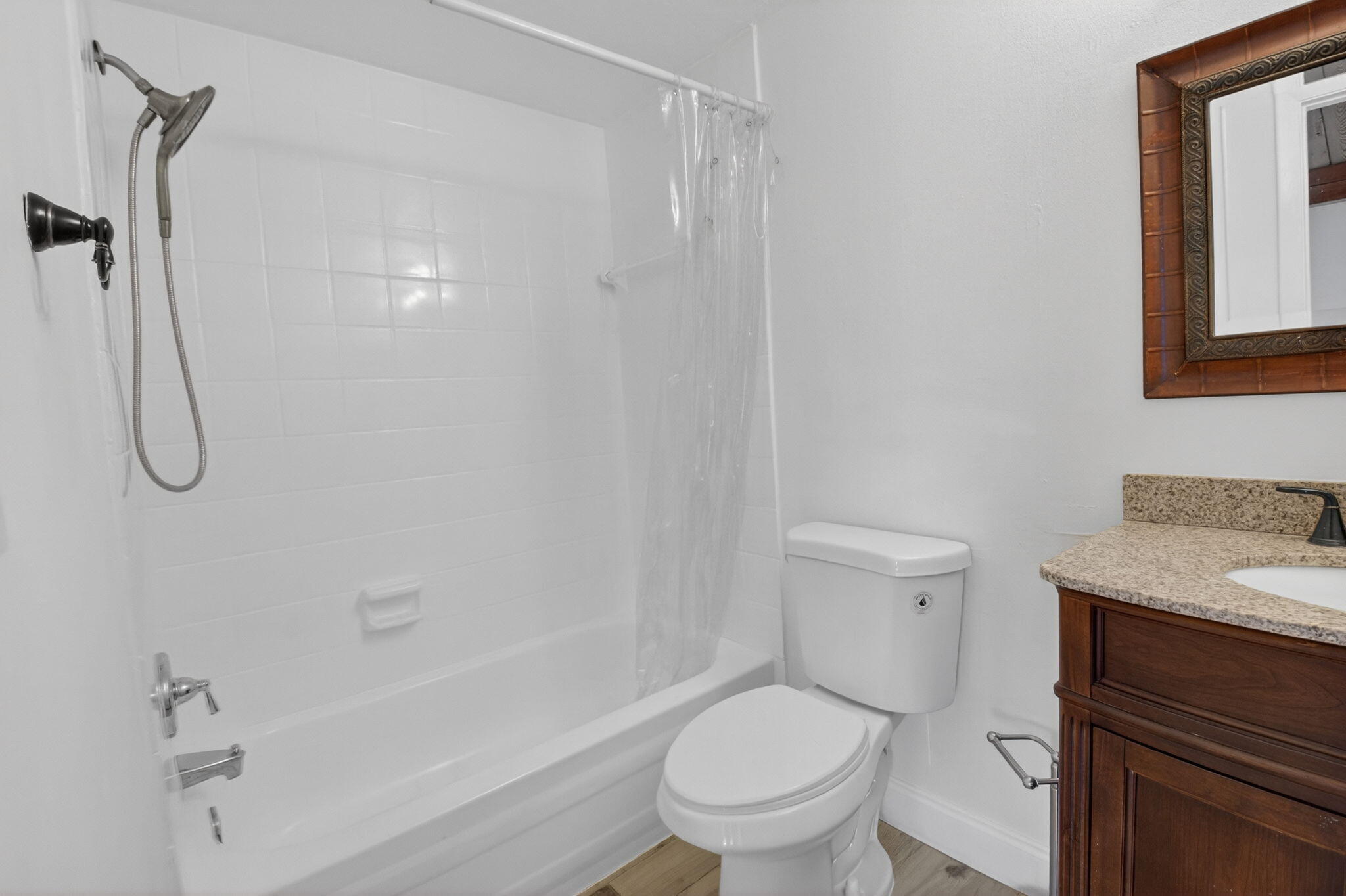 4761 Northwest 2nd Avenue, Unit 301 Boca Raton, FL 33431 - Photo 44 of 56 a bathroom with a granite countertop toilet sink and shower