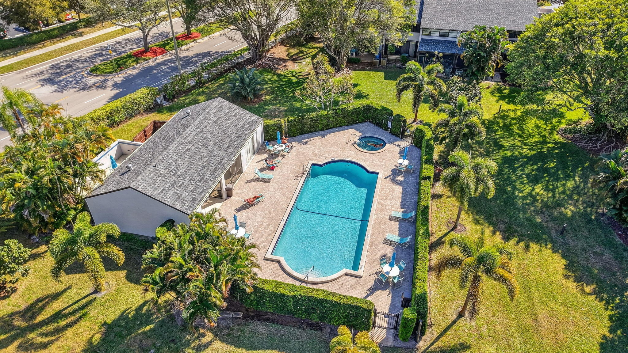 4761 Northwest 2nd Avenue, Unit 301 Boca Raton, FL 33431 - Photo 48 of 56 an aerial view of a house with swimming pool and large trees