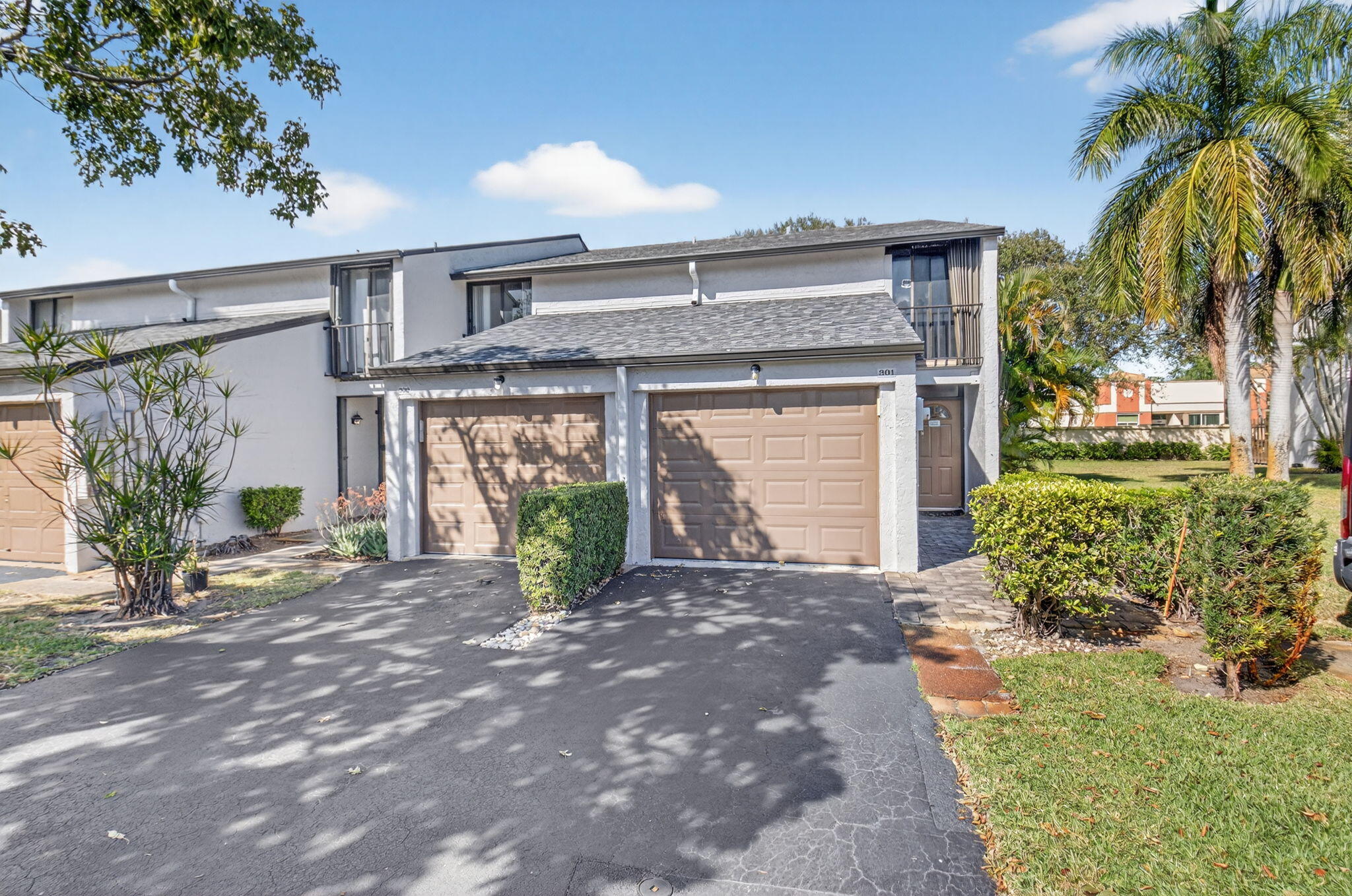 4761 Northwest 2nd Avenue, Unit 301 Boca Raton, FL 33431 - Photo 6 of 56 a front view of a house with garden