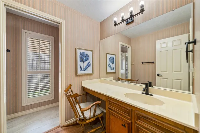 a view of a kitchen with a refrigerator a sink dishwasher and a fireplace