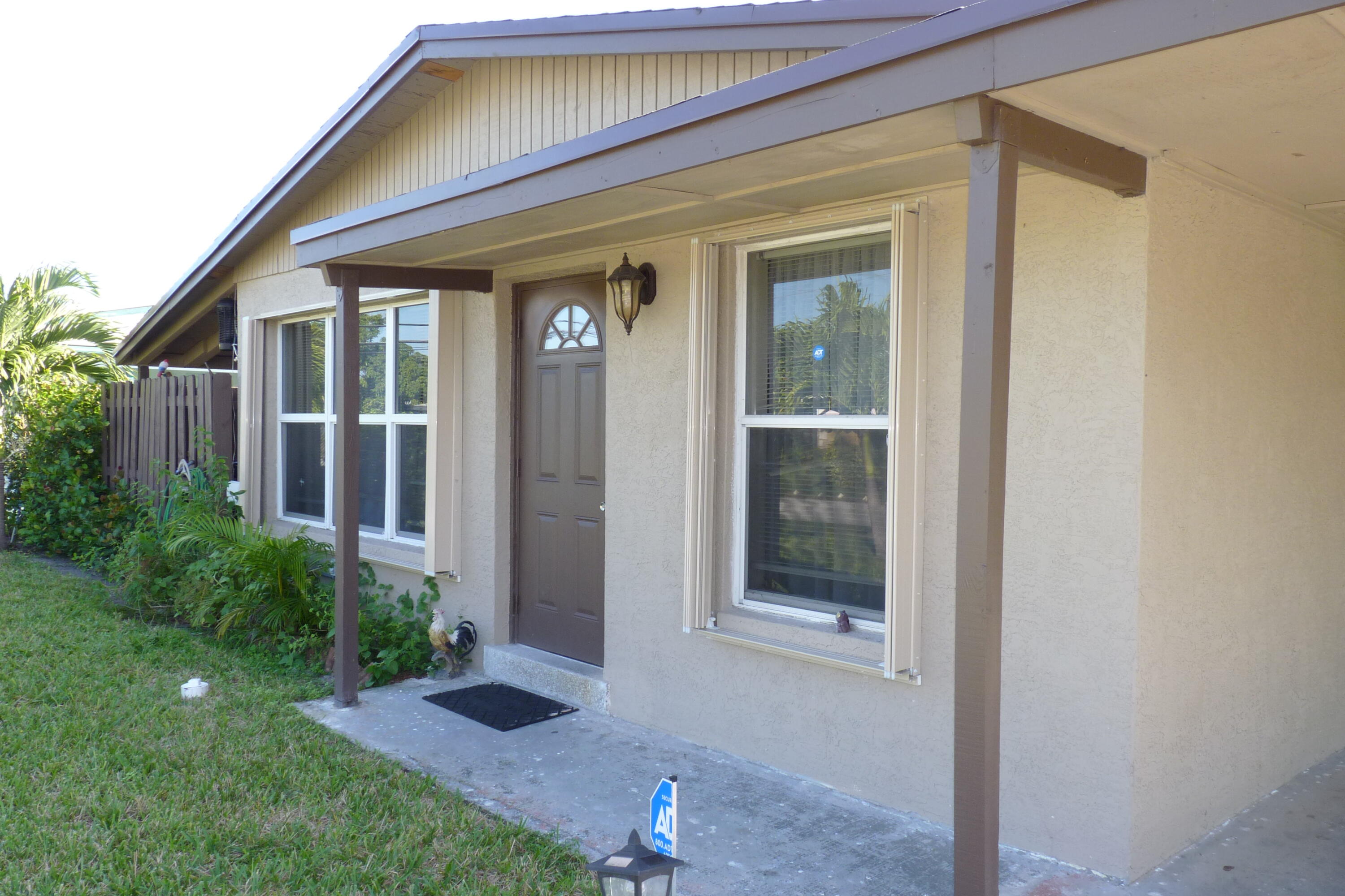 1211 West 2nd Street Riviera Beach, FL 33404 - Photo 1 of 30 MLS FRONT WALK