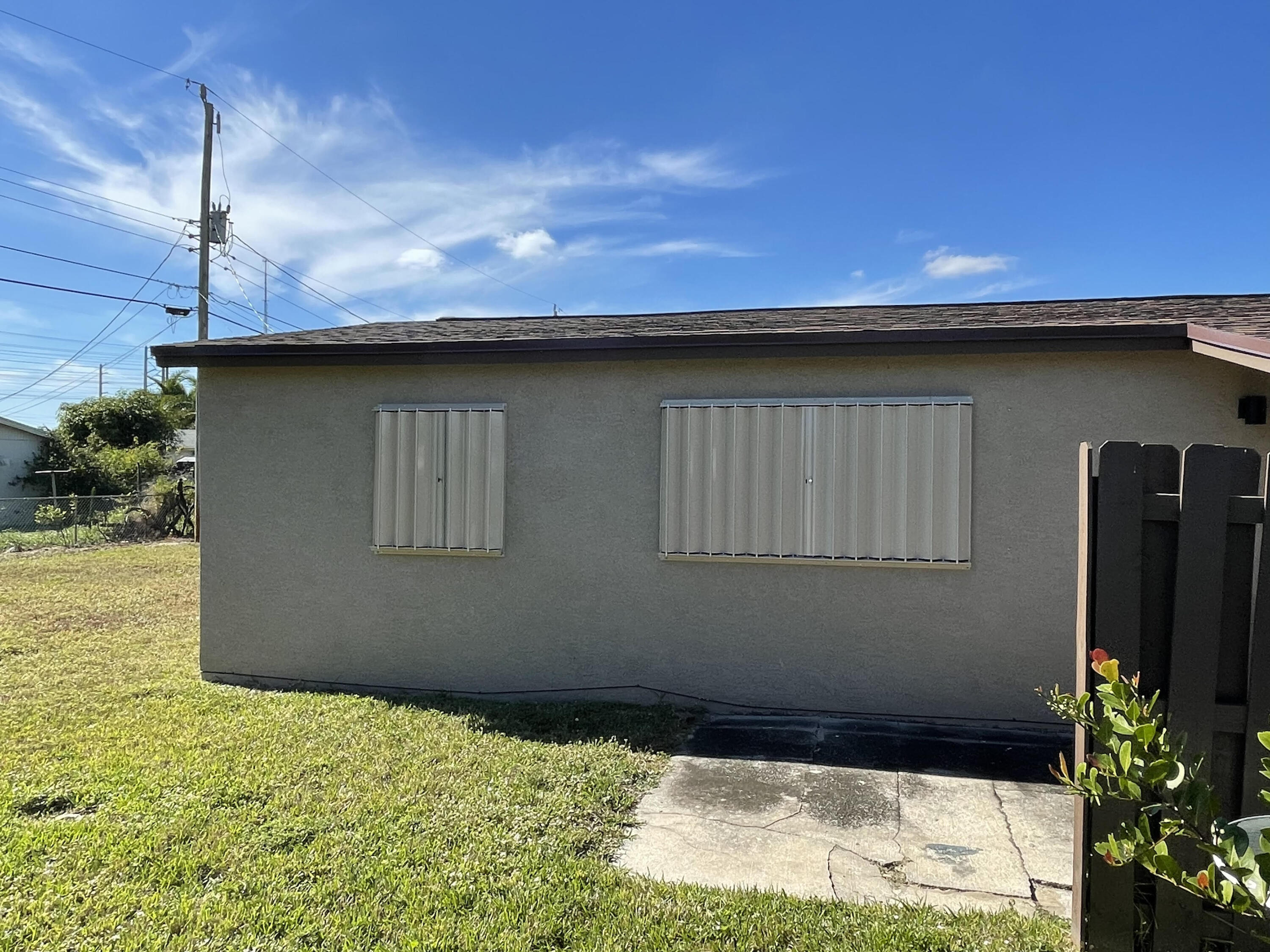 1211 West 2nd Street Riviera Beach, FL 33404 - Photo 24 of 30 MLS WINDOW PROTECTION