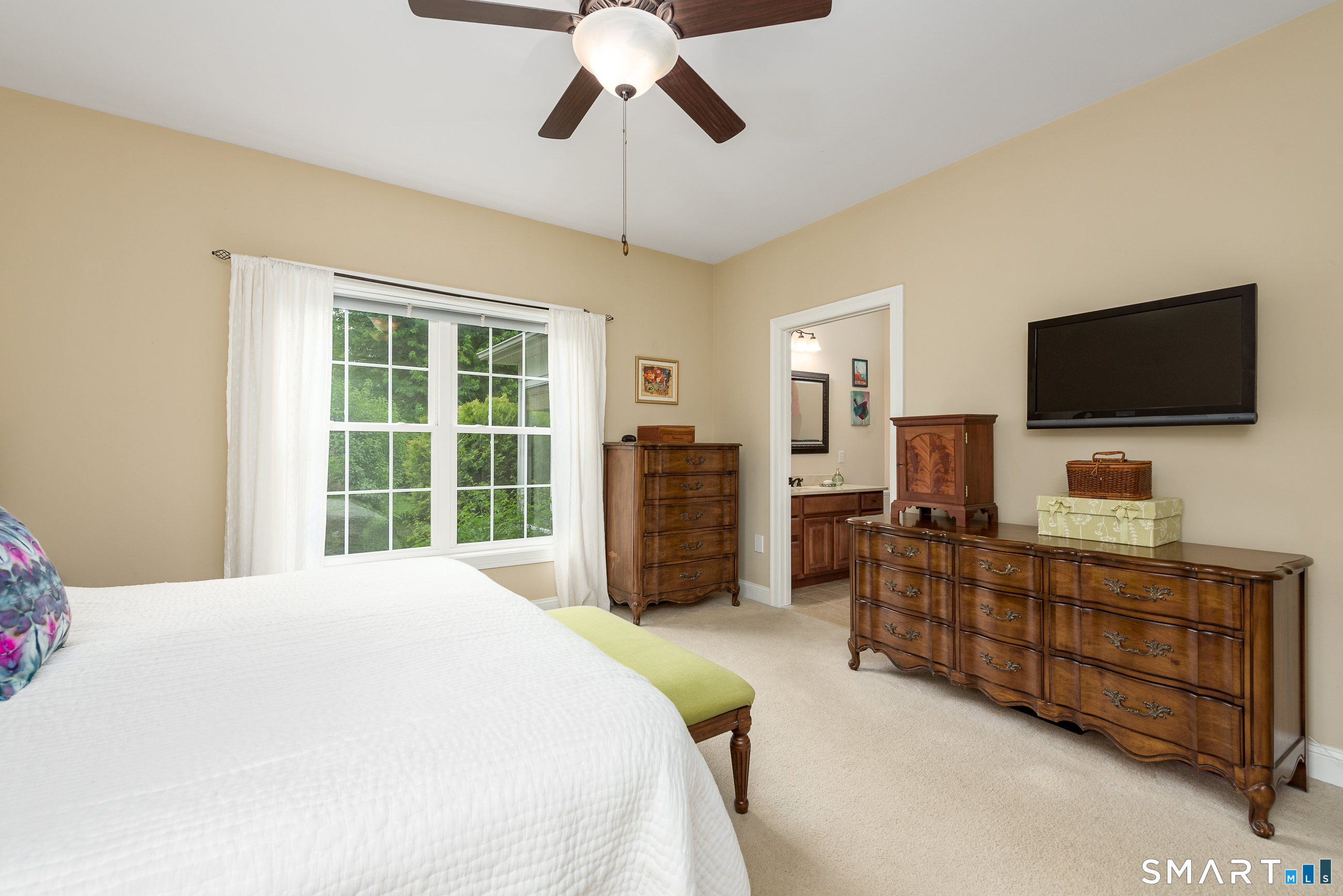 8 Greendale Drive, Unit 8 Suffield, CT 06078 - Photo 27 of 40 a bedroom with a bed and a flat screen tv