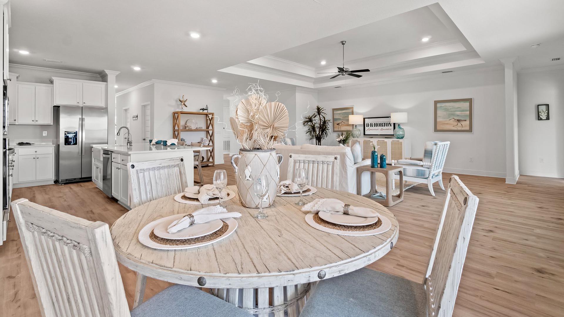 49 West Farm Owl Drive Freeport, FL 32439 - Photo 13 of 32 a dining room with furniture a wooden floor and kitchen view