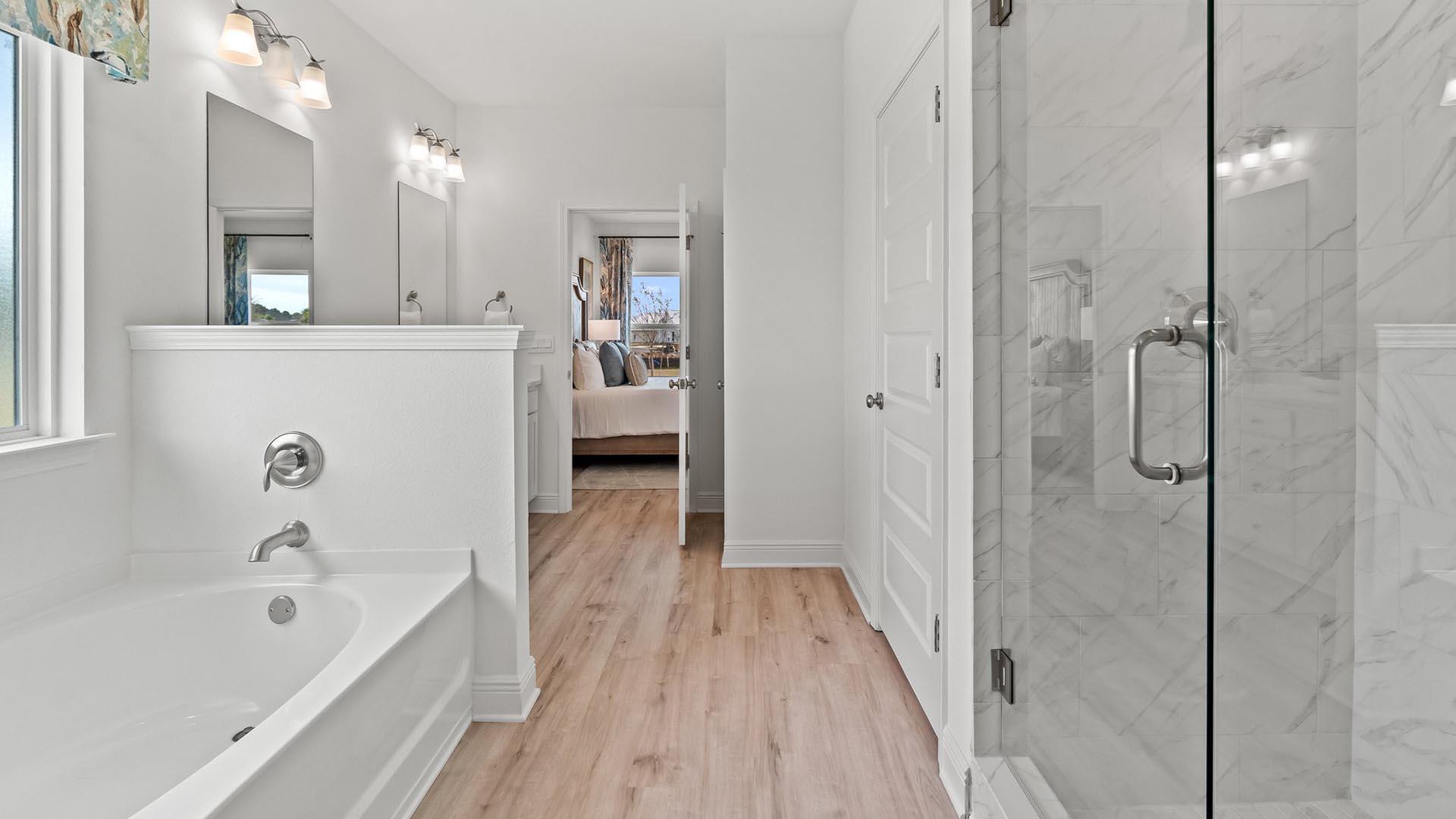 49 West Farm Owl Drive Freeport, FL 32439 - Photo 19 of 32 a bathroom with a bathtub a sink a mirror and a shower