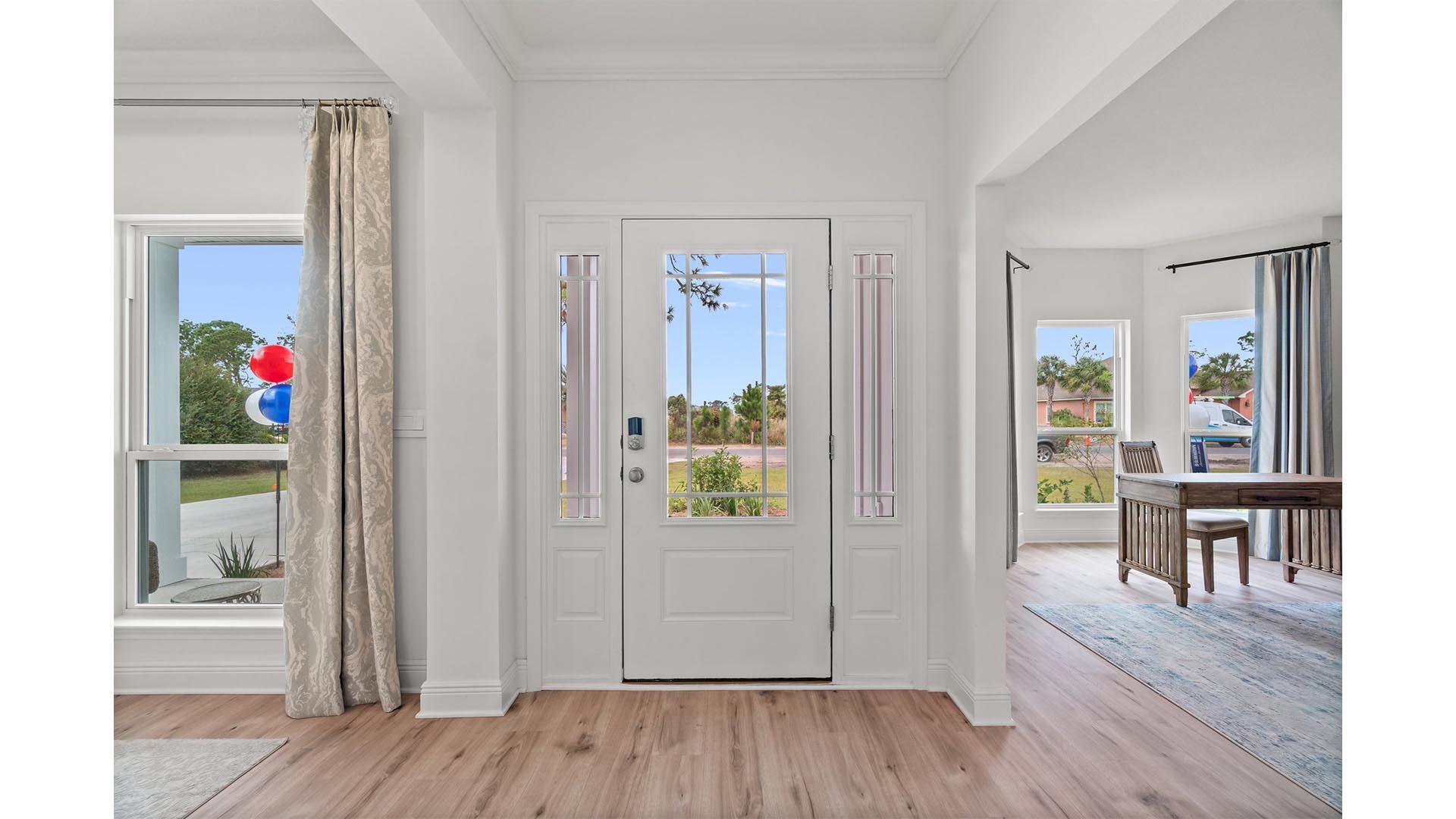 49 West Farm Owl Drive Freeport, FL 32439 - Photo 2 of 32 a view of a hallway with wooden floor and dining room