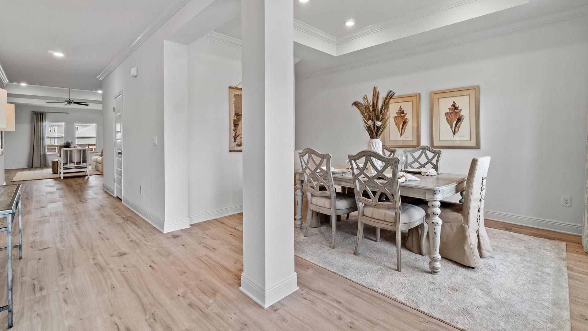 49 West Farm Owl Drive Freeport, FL 32439 - Photo 3 of 32 a view of a dining room with furniture and wooden floor