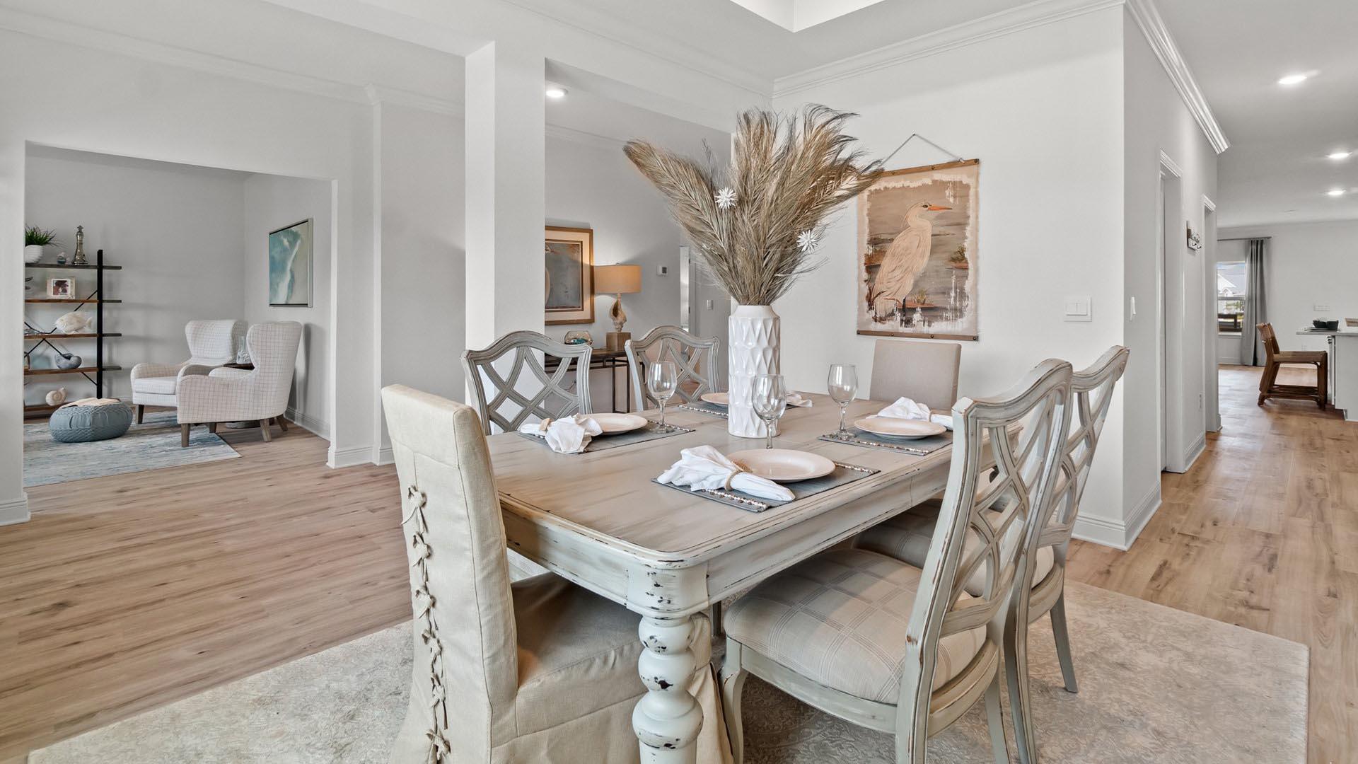 49 West Farm Owl Drive Freeport, FL 32439 - Photo 4 of 32 a view of a dining room with furniture and wooden floor