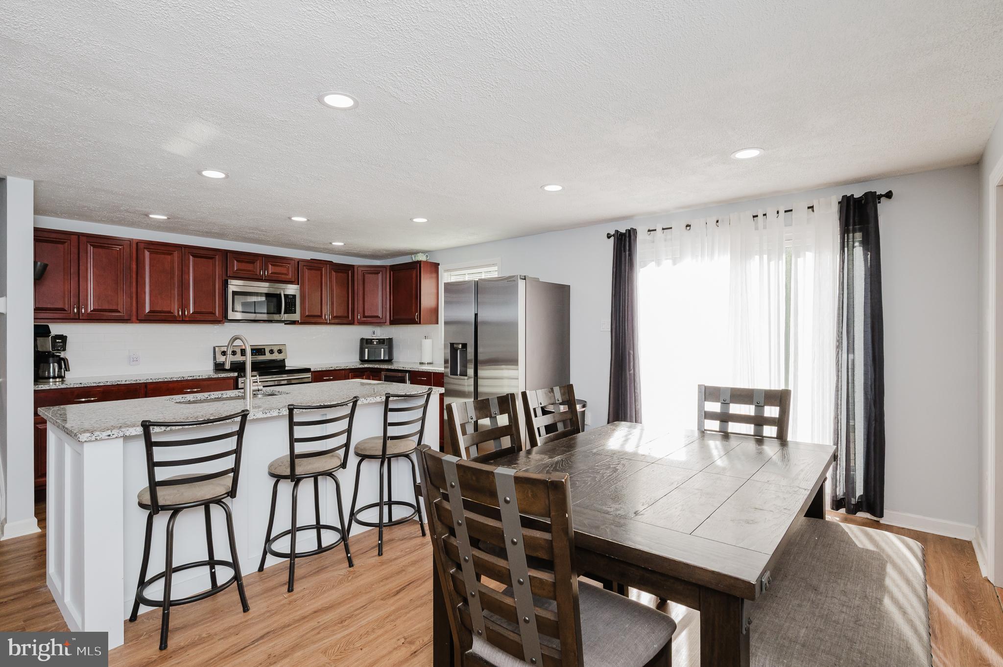 930 Edmund Street Aberdeen, MD 21001 - Photo 14 of 61 a view of a dining room with furniture